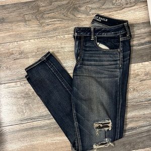Blue/off white America Eagle super stretch jegging  ripped jeans. Size 12.